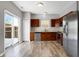 Modern kitchen with stainless steel appliances and wood cabinets at 5632 Wild Horse Dr, Indianapolis, IN 46239