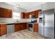 Modern kitchen with stainless steel appliances and wood cabinets at 5632 Wild Horse Dr, Indianapolis, IN 46239