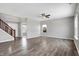 Spacious living room with laminate floors and ceiling fan at 5632 Wild Horse Dr, Indianapolis, IN 46239