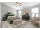Spacious main bedroom with a large bed, plush carpet, and ample natural light at 5632 Wild Horse Dr, Indianapolis, IN 46239
