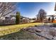 Large backyard with a patio, wood fence, and mature trees perfect for outdoor entertaining at 5838 W Bayfield Dr, McCordsville, IN 46055