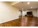 Finished basement featuring wood floors and neutral colored walls at 5838 W Bayfield Dr, McCordsville, IN 46055