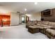 Spacious finished basement featuring plush carpeting and an open layout, perfect for various activities at 5838 W Bayfield Dr, McCordsville, IN 46055