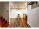 Basement bar area with pendant lighting, sink, and countertop, perfect for entertaining guests at 5838 W Bayfield Dr, McCordsville, IN 46055