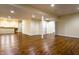 Large basement area with wooden floors, bar access, and an open layout at 5838 W Bayfield Dr, McCordsville, IN 46055