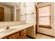Bathroom featuring marble countertops, a wood cabinet, and a window for natural light at 5838 W Bayfield Dr, McCordsville, IN 46055