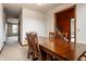 Comfortable dining room featuring a large wooden table, soft carpet, and lots of natural light at 5838 W Bayfield Dr, McCordsville, IN 46055