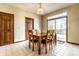 Inviting dining room with a wood table set, sliding glass doors, and tile flooring for easy maintenance at 5838 W Bayfield Dr, McCordsville, IN 46055