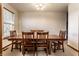 Formal dining room featuring a large wooden table with seating for six and a bright window at 5838 W Bayfield Dr, McCordsville, IN 46055