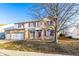 Lovely two-story home with brick accents, red shutters, and a well-kept lawn under a clear blue sky at 5838 W Bayfield Dr, McCordsville, IN 46055