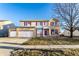 Charming two-story home with a two-car garage and well-maintained front lawn, perfect for suburban living at 5838 W Bayfield Dr, McCordsville, IN 46055