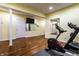Home gym with mounted TV and fitness equipment at 5838 W Bayfield Dr, McCordsville, IN 46055