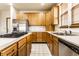 Modern kitchen with stainless steel appliances, light wood cabinetry, and a spacious countertop at 5838 W Bayfield Dr, McCordsville, IN 46055