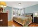 Cozy bedroom with hardwood floors and ample natural light at 620 Mulberry St, Zionsville, IN 46077