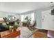 Living room with hardwood floors, fireplace, and rocking chair at 620 Mulberry St, Zionsville, IN 46077