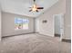 Empty bedroom with vaulted ceiling, ceiling fan, and a large window with natural light at 6663 Trailside Dr, Avon, IN 46123