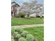 Landscaped front yard with blooming cherry tree and lush greenery at 6663 Trailside Dr, Avon, IN 46123