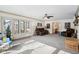 Sunlit living room featuring comfortable seating and access to backyard at 6711 E 10Th St, Indianapolis, IN 46219