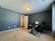 Home office with neutral walls, carpeted floor, and built in desk at 837 Trotter Ct, Greenwood, IN 46143