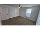 Spacious bedroom with ceiling fan and neutral carpet at 847 Udell St, Indianapolis, IN 46208