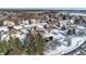 Aerial view of a residential neighborhood in winter, houses with snow covered roofs at 8782 Bay Pointe Cir, Indianapolis, IN 46236