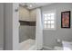 Bathroom with shower/tub combo and gray tile at 8782 Bay Pointe Cir, Indianapolis, IN 46236