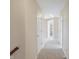 Bright hallway with neutral walls and carpet, leading to bedrooms and other rooms at 8782 Bay Pointe Cir, Indianapolis, IN 46236