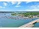 Aerial view of a lake marina filled with boats and a bridge in a picturesque setting at 9275 Eastwind Dr, Indianapolis, IN 46256