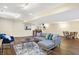 Finished basement features a cozy sectional sofa and a small wet bar area for entertaining guests at 9275 Eastwind Dr, Indianapolis, IN 46256
