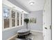 Hallway with bench seat underneath natural light window and a view of the outdoors at 9275 Eastwind Dr, Indianapolis, IN 46256