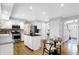 Bright kitchen with stainless steel appliances, an island, and hardwood floors at 9275 Eastwind Dr, Indianapolis, IN 46256