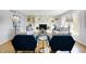 Cozy living room with built-in shelves, fireplace, hardwood floors, and comfortable seating at 9275 Eastwind Dr, Indianapolis, IN 46256