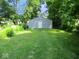 A serene backyard with detached garage, perfect for outdoor activities at 1138 W 33Rd St, Indianapolis, IN 46208