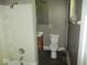 Modest bathroom features a shower-tub combo, vanity and toilet at 1138 W 33Rd St, Indianapolis, IN 46208