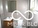 Small bathroom with white sink and toilet at 1138 W 33Rd St, Indianapolis, IN 46208