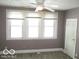 Bedroom with gray walls, three windows, and carpet at 1138 W 33Rd St, Indianapolis, IN 46208