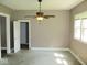 Serene bedroom offering a ceiling fan and natural light, and doorway providing versatile layout options at 1138 W 33Rd St, Indianapolis, IN 46208