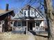 Charming two-story home featuring a inviting front porch and classic architectural details at 1138 W 33Rd St, Indianapolis, IN 46208