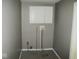 Compact laundry room with white cabinetry and connections at 1138 W 33Rd St, Indianapolis, IN 46208