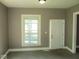 Inviting living room boasting a large window, fresh paint, and a welcoming atmosphere at 1138 W 33Rd St, Indianapolis, IN 46208