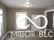 Simple living room with gray walls and neutral flooring at 1138 W 33Rd St, Indianapolis, IN 46208