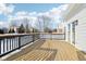 Spacious deck with black railings, offering a view of the backyard in winter at 13172 Antonia Blvd, Carmel, IN 46074