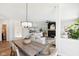 Bright dining room with wood table and access to living room and kitchen at 13172 Antonia Blvd, Carmel, IN 46074