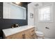 Updated bathroom with a modern vanity and black and white accents at 15236 Countfleet Ct, Carmel, IN 46032