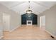 Open living room showcasing a fireplace and hardwood floors at 15236 Countfleet Ct, Carmel, IN 46032