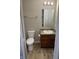 Small bathroom with toilet, sink, and vanity at 1608 Wagner Dr, Shelbyville, IN 46176