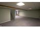 Unfinished basement with carpeted floor and ample space at 1685 Juniper Dr, Columbus, IN 47201