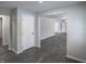 Clean and bright hallway with gray walls and dark gray floors at 1685 Juniper Dr, Columbus, IN 47201