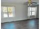 Spacious living room featuring hardwood floors and ample natural light at 1685 Juniper Dr, Columbus, IN 47201