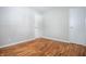 Neutral bedroom with hardwood floors and two closets at 1707 E 45Th St, Anderson, IN 46013